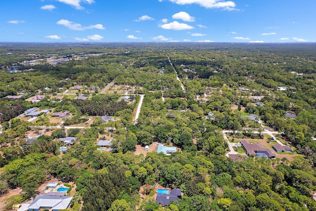 drone / aerial view with a view of trees