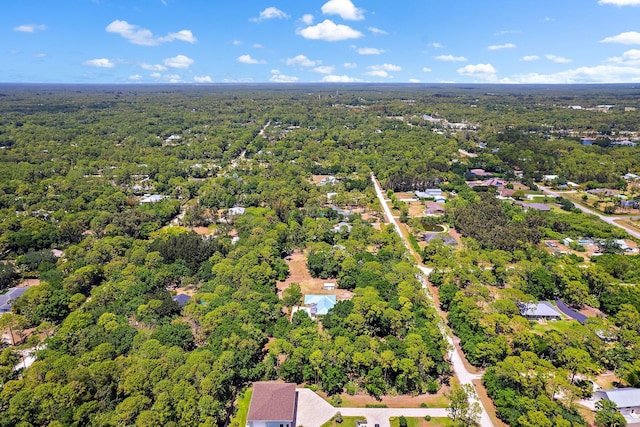 aerial view featuring a view of trees