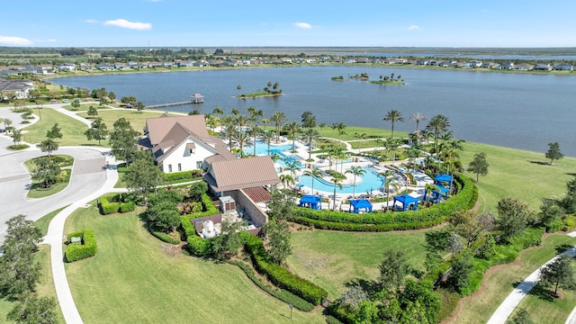 birds eye view of property with a water view