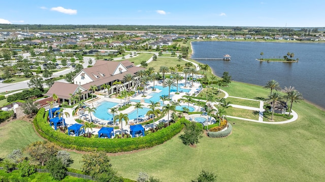 birds eye view of property with a water view
