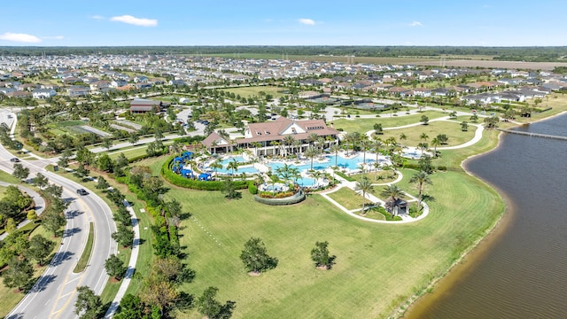 birds eye view of property featuring a water view and a residential view