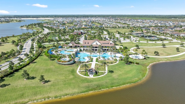 birds eye view of property with a water view and a residential view