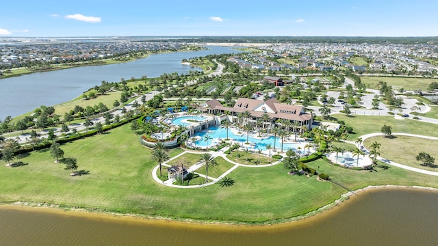 drone / aerial view with a water view and a residential view
