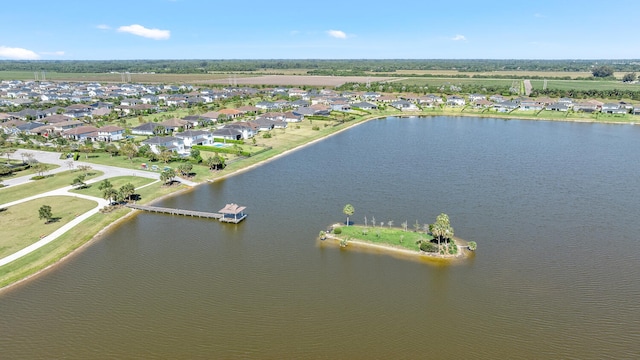 bird's eye view with a water view and a residential view