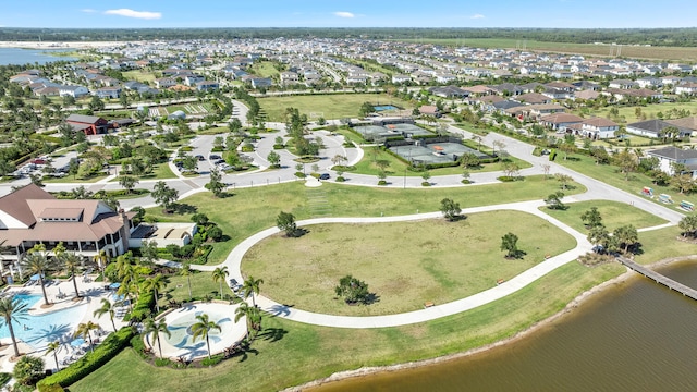 birds eye view of property featuring a water view and a residential view