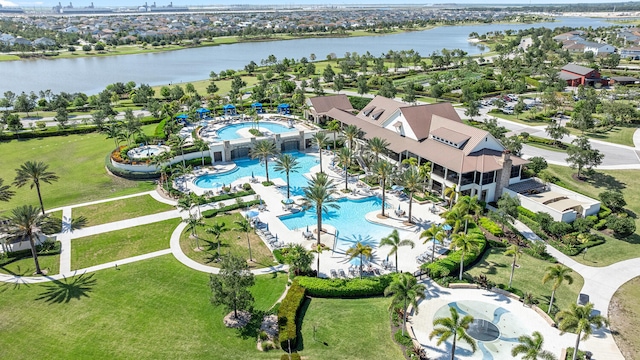 birds eye view of property with a water view