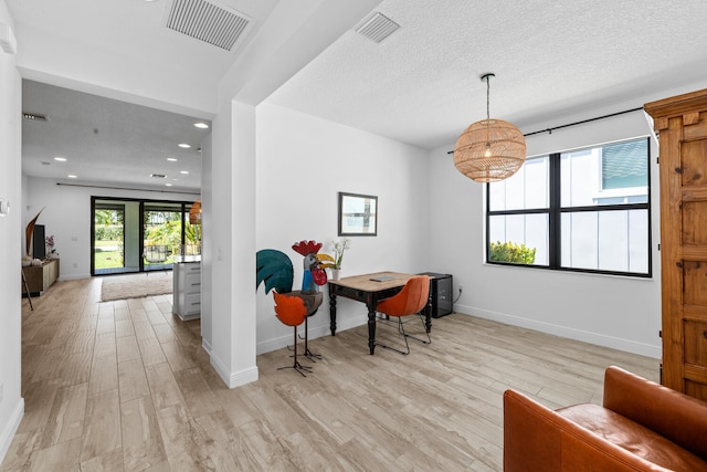 office featuring visible vents, recessed lighting, light wood-style floors, and baseboards