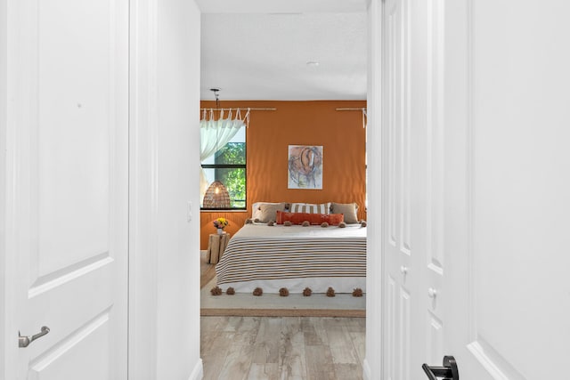 bedroom featuring light wood-style flooring