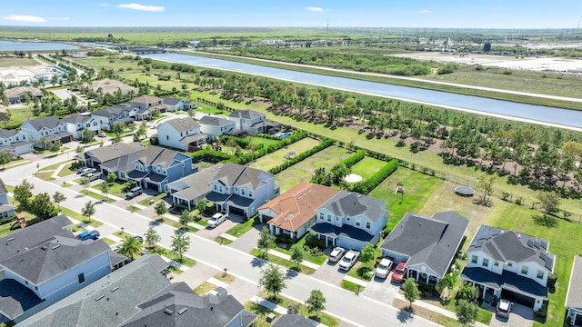 aerial view featuring a water view and a residential view