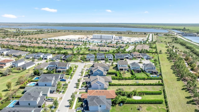 bird's eye view with a water view and a residential view