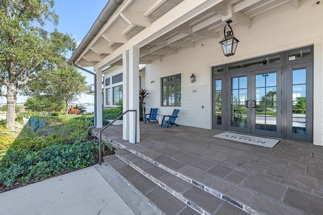view of patio / terrace featuring a porch and french doors