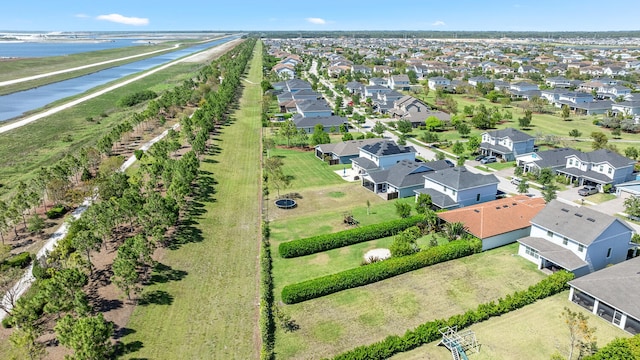 bird's eye view featuring a residential view and a water view