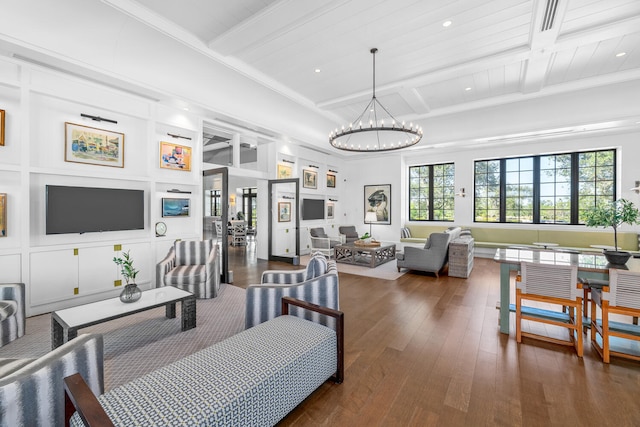living room featuring wood-type flooring, beam ceiling, recessed lighting, coffered ceiling, and a notable chandelier