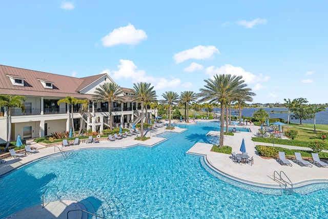 pool featuring stairway and a patio area