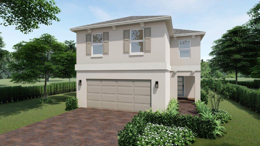 view of front of property with stucco siding, an attached garage, decorative driveway, and a front yard