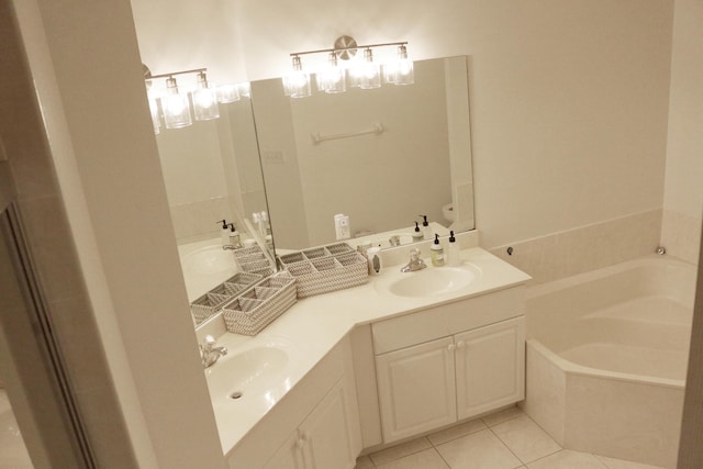 12582 Shoreline Dr, Wellington, FL 33414 - bathroom featuring a sink, tile patterned flooring, a garden tub, and double vanity