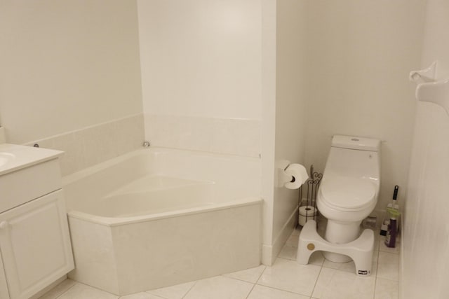 12582 Shoreline Dr, Wellington, FL 33414 - bathroom featuring tile patterned flooring, a bath, toilet, and vanity