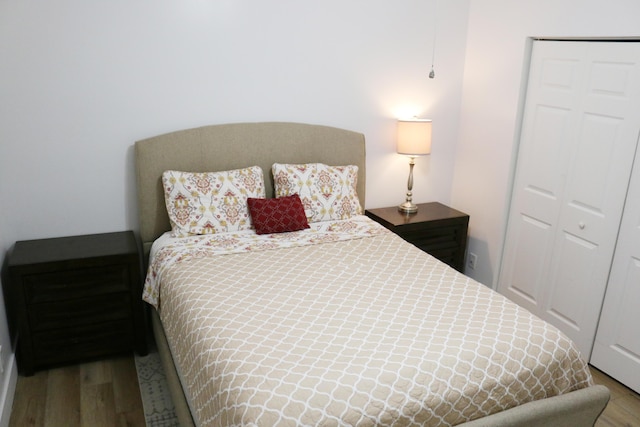 12582 Shoreline Dr, Wellington, FL 33414 - bedroom featuring a closet and wood finished floors