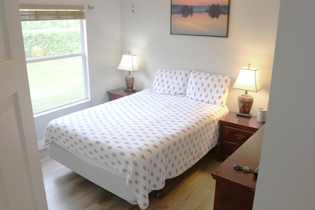 12582 Shoreline Dr, Wellington, FL 33414 - bedroom featuring multiple windows and wood finished floors