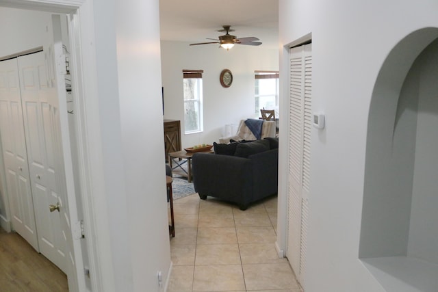 12582 Shoreline Dr, Wellington, FL 33414 - hallway featuring light tile patterned floors and arched walkways