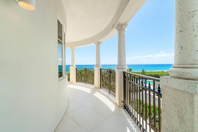 balcony featuring a water view