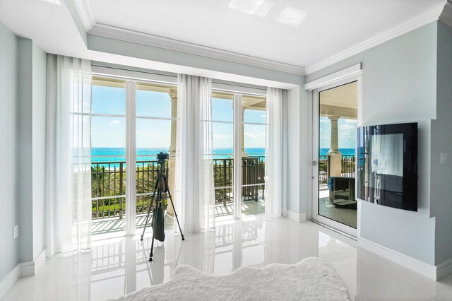 tiled bedroom featuring access to outside, crown molding, a water view, and baseboards