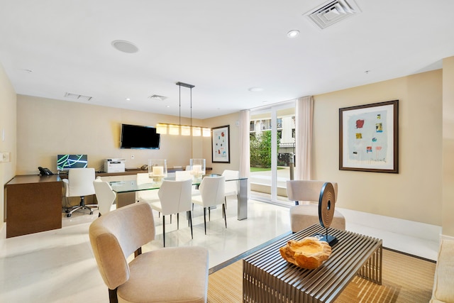 dining space with recessed lighting