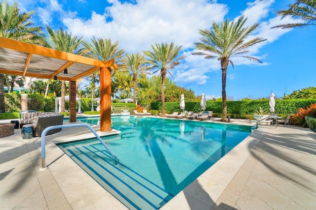 outdoor pool with a patio area