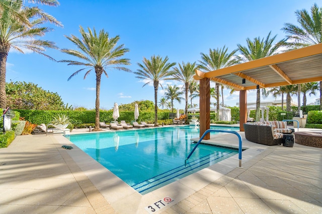community pool with a patio area