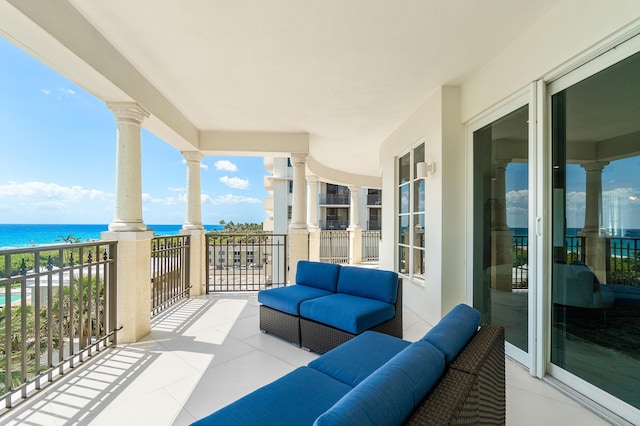 balcony featuring a water view and outdoor lounge area