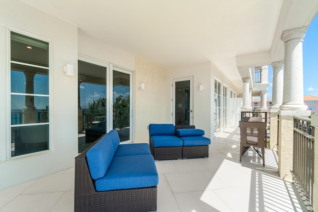 view of patio featuring a balcony and outdoor lounge area