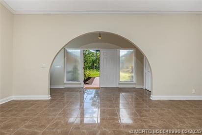 5361 SW Windward Way, Palm City, FL 34990 - foyer featuring arched walkways, crown molding, and baseboards