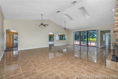 5361 SW Windward Way, Palm City, FL 34990 - unfurnished living room with a ceiling fan, vaulted ceiling, baseboards, and arched walkways