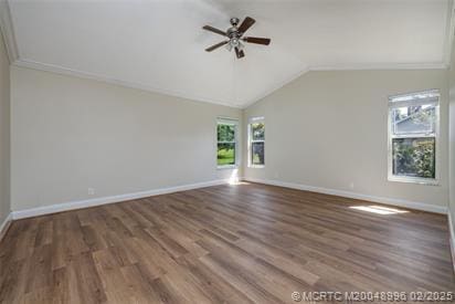 5361 SW Windward Way, Palm City, FL 34990 - empty room with plenty of natural light, a ceiling fan, wood finished floors, vaulted ceiling, and baseboards