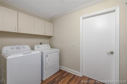 5361 SW Windward Way, Palm City, FL 34990 - laundry room with cabinet space, washer and clothes dryer, ornamental molding, dark wood-type flooring, and baseboards