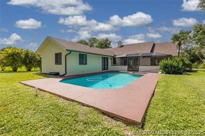 5361 SW Windward Way, Palm City, FL 34990 - rear view of house with a patio area, a yard, and an outdoor pool