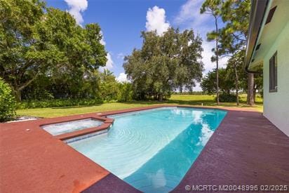 5361 SW Windward Way, Palm City, FL 34990 - view of swimming pool with a pool with connected hot tub and a yard