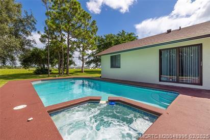 5361 SW Windward Way, Palm City, FL 34990 - outdoor pool with an in-ground hot tub