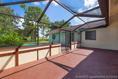 5361 SW Windward Way, Palm City, FL 34990 - view of patio / terrace with a lanai and a pool