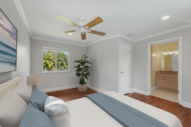 5361 SW Windward Way, Palm City, FL 34990 - bedroom with wood finished floors, a sink, crown molding, baseboards, and a ceiling fan
