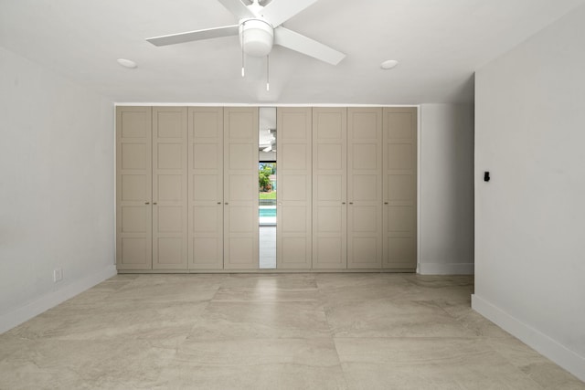 1516 Wagner Cir, Lake Clarke Shores, FL 33406 - unfurnished bedroom featuring baseboards and ceiling fan