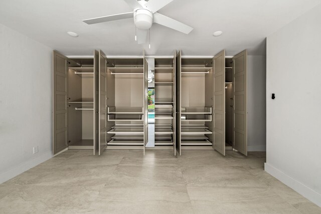 1516 Wagner Cir, Lake Clarke Shores, FL 33406 - unfurnished bedroom with two closets, baseboards, and ceiling fan