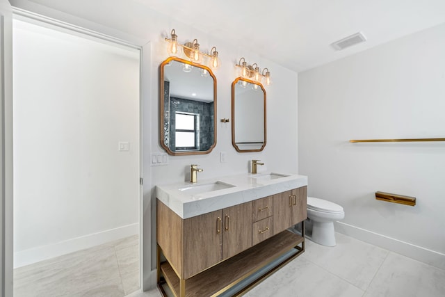 1516 Wagner Cir, Lake Clarke Shores, FL 33406 - full bath with visible vents, a sink, double vanity, and toilet