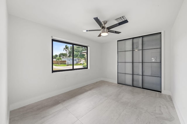1516 Wagner Cir, Lake Clarke Shores, FL 33406 - unfurnished room featuring baseboards, a ceiling fan, and visible vents