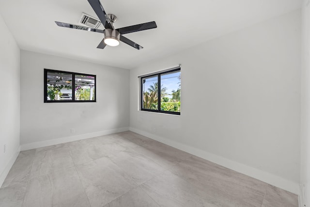 1516 Wagner Cir, Lake Clarke Shores, FL 33406 - spare room with a healthy amount of sunlight, baseboards, ceiling fan, and visible vents