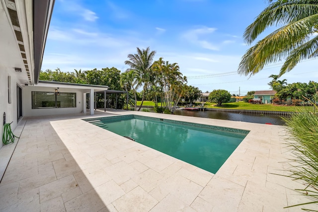1516 Wagner Cir, Lake Clarke Shores, FL 33406 - outdoor pool with a patio area and a water view