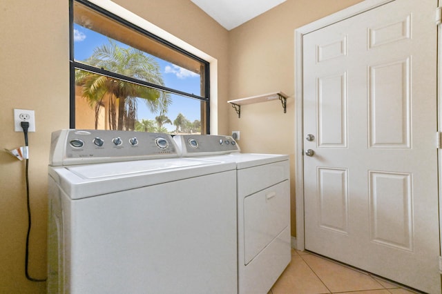 2602 SW 23rd Cranbrook Dr, Boynton Beach, FL 33436 - washroom with washing machine and clothes dryer and light tile patterned floors