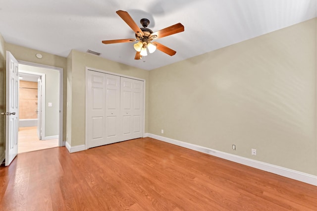 2602 SW 23rd Cranbrook Dr, Boynton Beach, FL 33436 - unfurnished bedroom featuring baseboards, wood finished floors, a closet, and ceiling fan