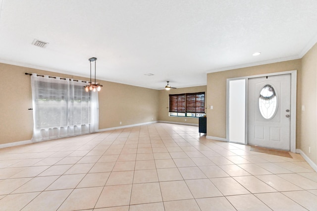 2602 SW 23rd Cranbrook Dr, Boynton Beach, FL 33436 - entryway featuring crown molding, baseboards, a ceiling fan, and light tile patterned flooring