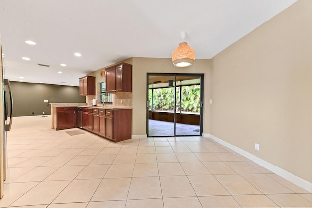 2602 SW 23rd Cranbrook Dr, Boynton Beach, FL 33436 - kitchen with light countertops, baseboards, stainless steel dishwasher, recessed lighting, and light tile patterned floors